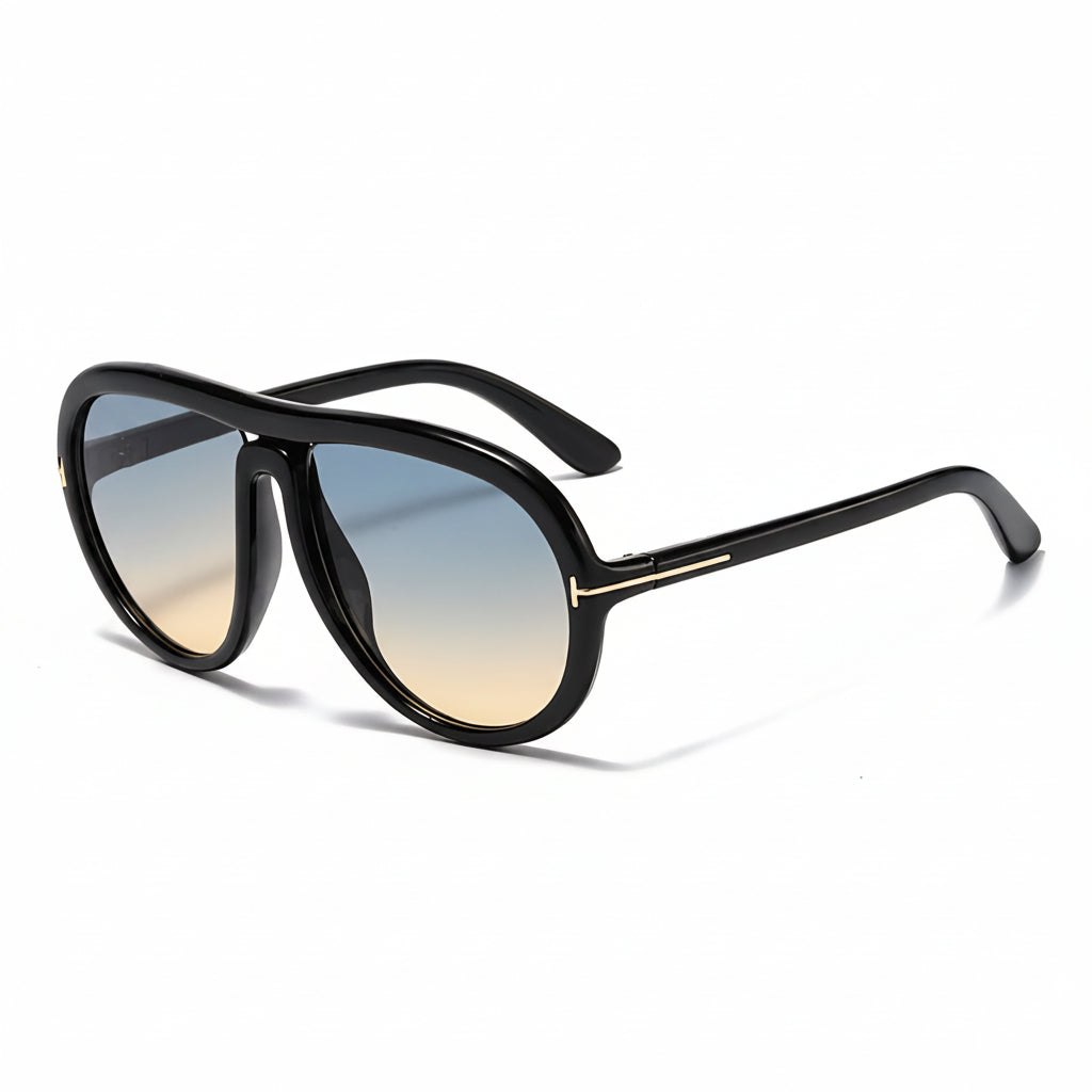 A pair of aviator-style sunglasses with a thick black frame and gradient lenses that fade from blue at the top to warm brown at the bottom. The text 'BLACK-BLUE BROWN' is displayed at the top of the image on a clean white background.