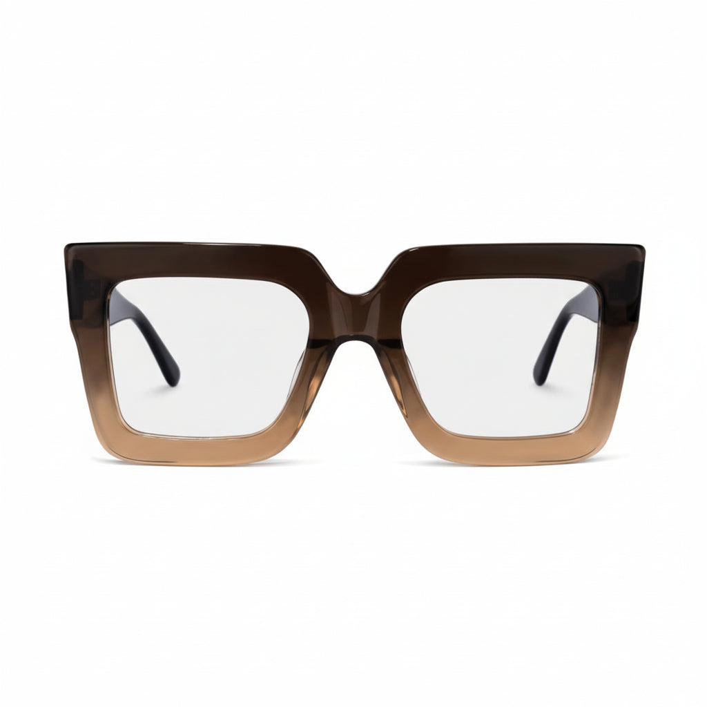 Brown and black gradient eyeglasses on a light gray background