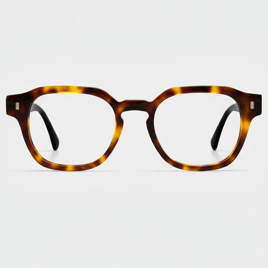 Tortoiseshell eyeglasses on a light gray background