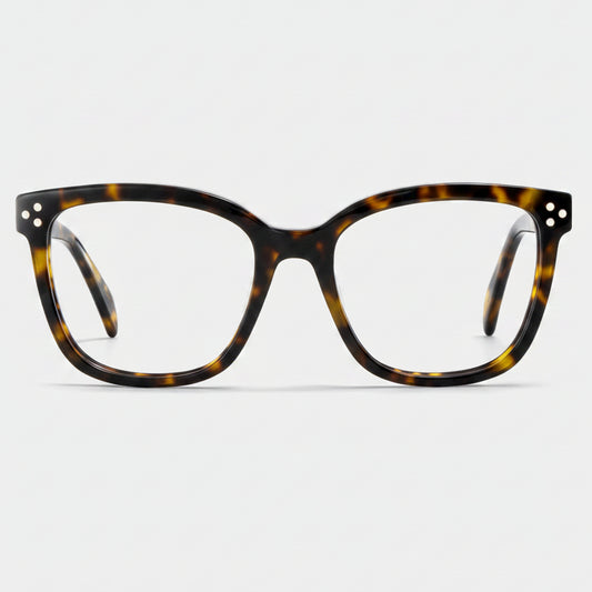 Tortoiseshell eyeglasses on a light gray background