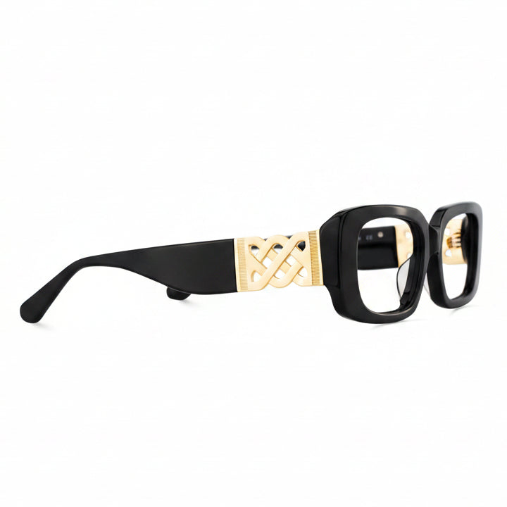 Black and gold eyeglasses on a white background