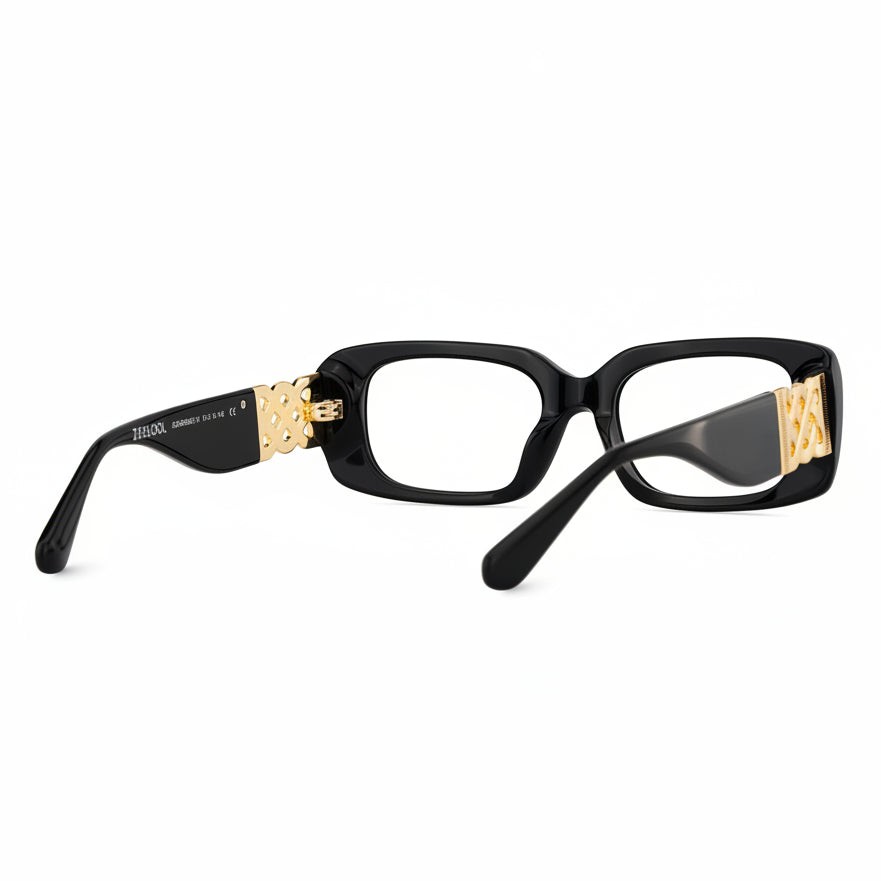 Black eyeglasses with gold accents on a white background