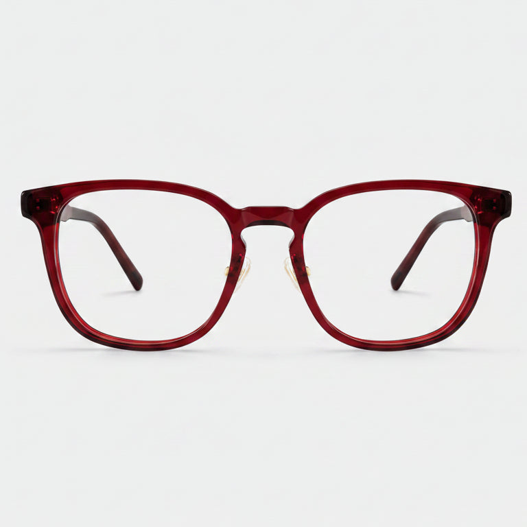 Red eyeglasses on a light gray background