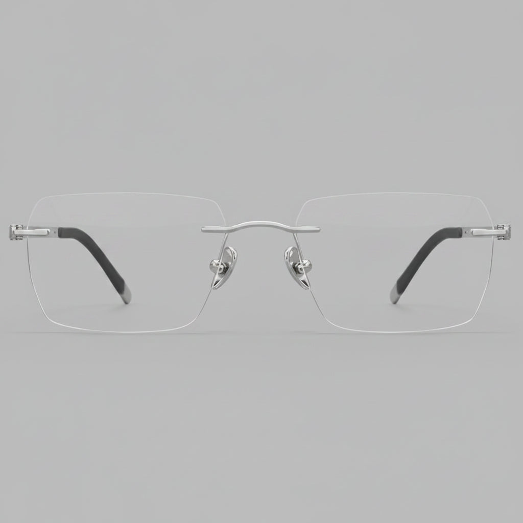 Silver rimless eyeglasses on a white background
