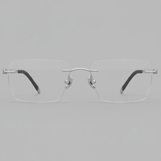 Silver rimless eyeglasses on a white background