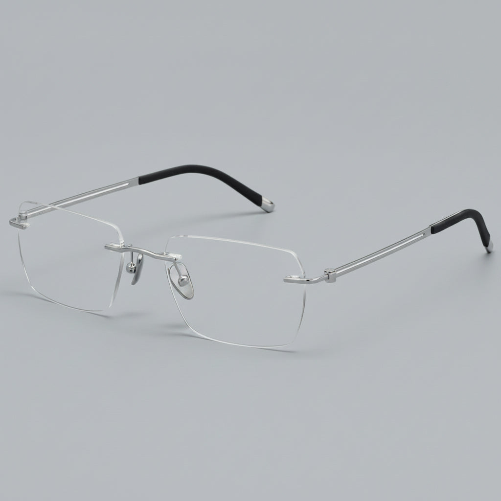 Silver rimless eyeglasses on a white background
