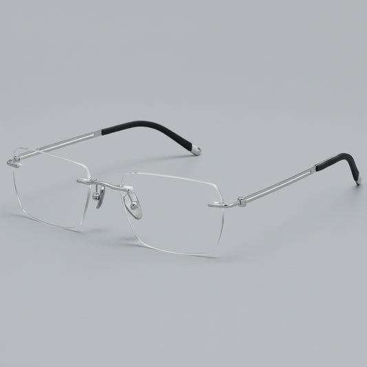 Silver rimless eyeglasses on a white background