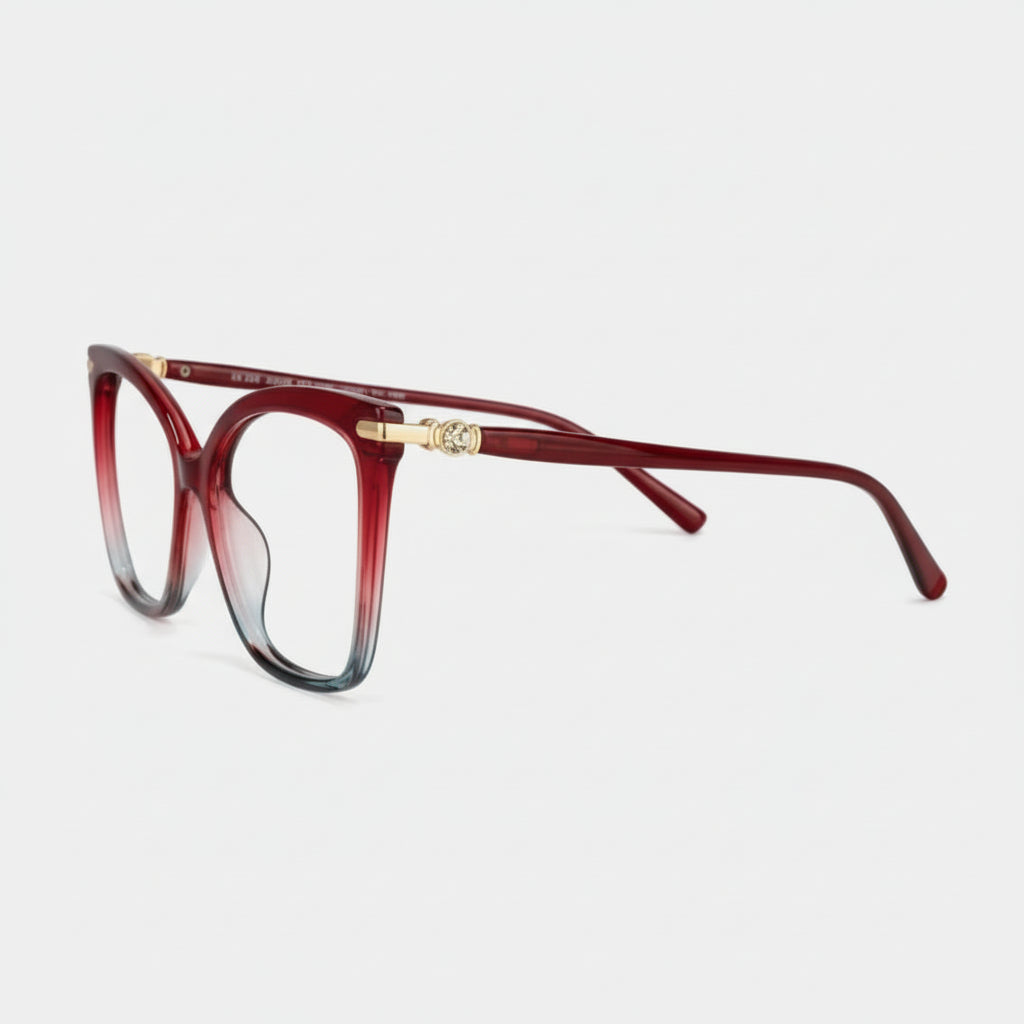 Red and gold eyeglasses on a white background